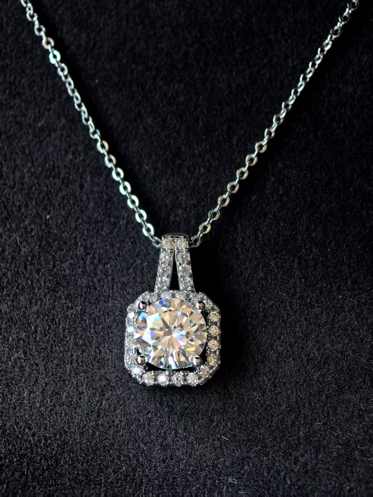 LUMIVIE laboratory-grown diamond halo pendant on black velvet